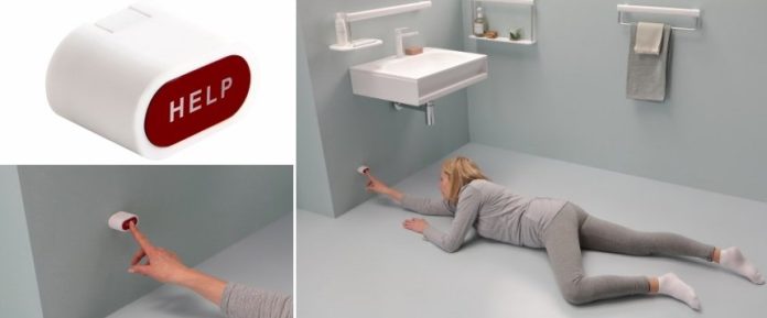 donna a terra mentre schiaccia pulsante per richiesta di soccorso in un ambiente bagno